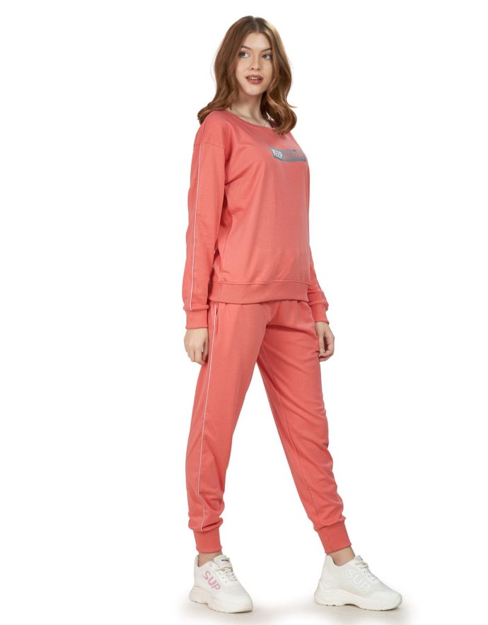 Side view of Women's Peach Tracksuit highlighting fit and style