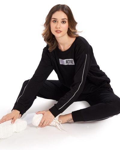 Close-up of fabric texture and Keep Active print on Women's Black Tracksuit